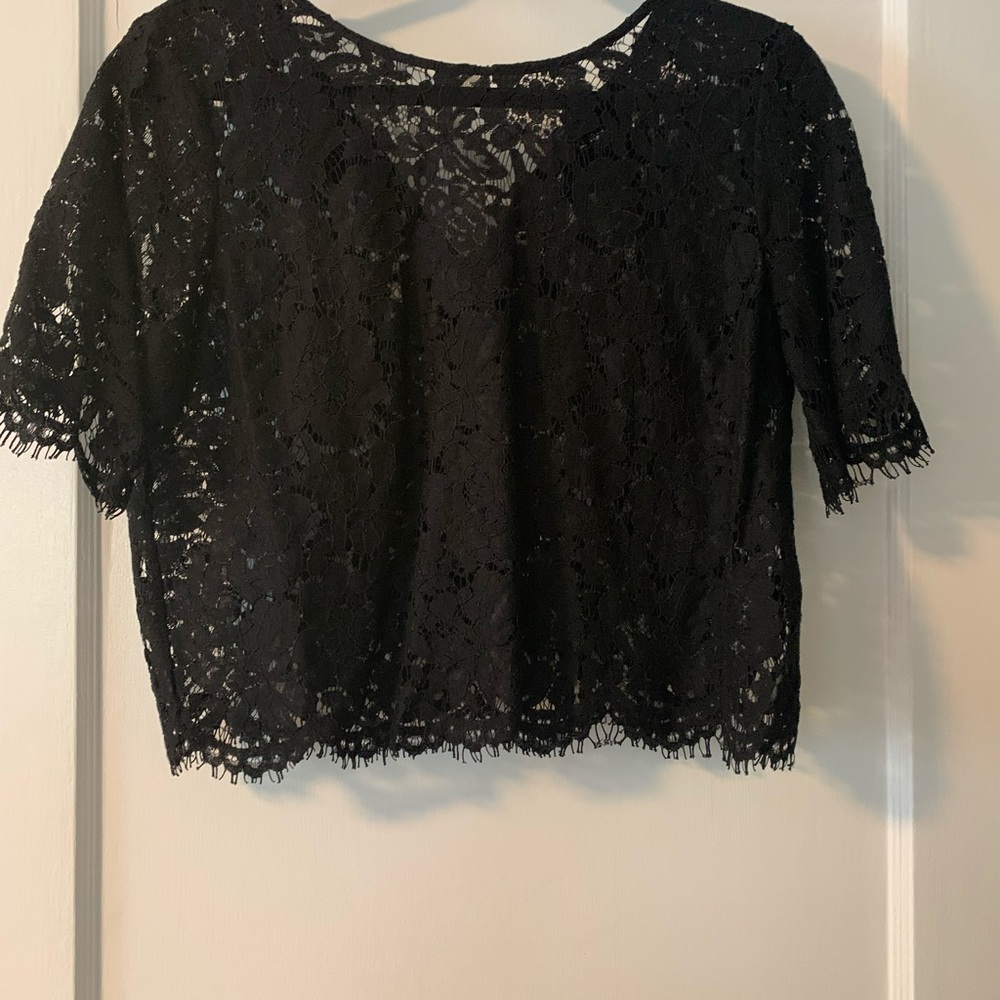 Lace black top. Short sleeves crop top. Like new.